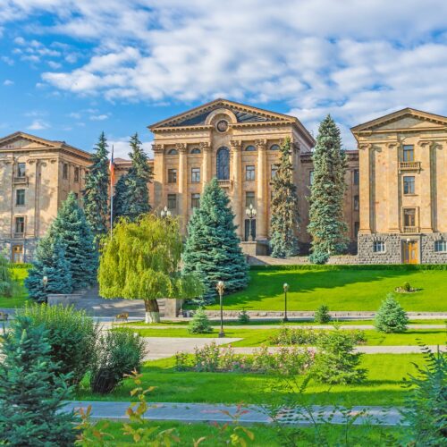 The building of National Assembly of Armenia (Parliament), surrounded by large garden, Yerevan, Armenia.
